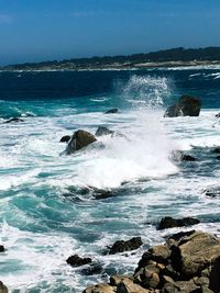 Waves splashing on rocks