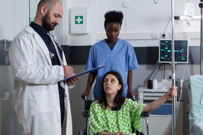 Portrait of female doctor standing in hospital