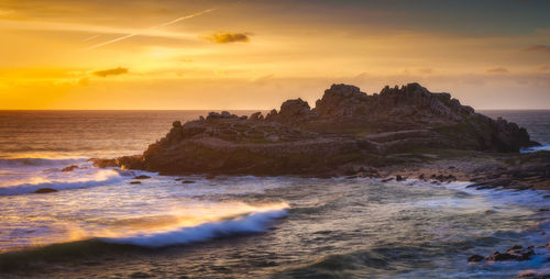 Scenic view of sea against sky during sunset