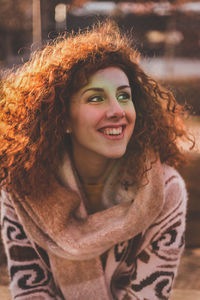 Close-up of smiling woman in warm clothing