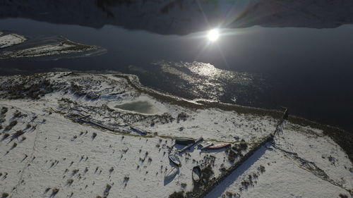 High angle view of snowcapped mountains against sky