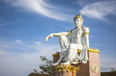 Low angle view of statue against sky