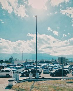 Cars on road against sky