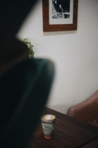 Close-up of coffee cup on table at home