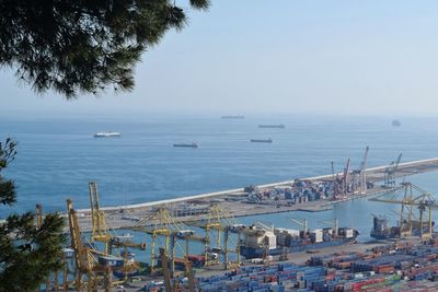 High angle view of boats moored in sea against clear sky