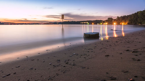 Scenic view of calm lake against sky