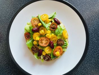 High angle view of fruits in plate on table