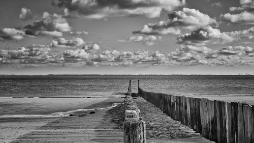 Scenic view of sea against cloudy sky