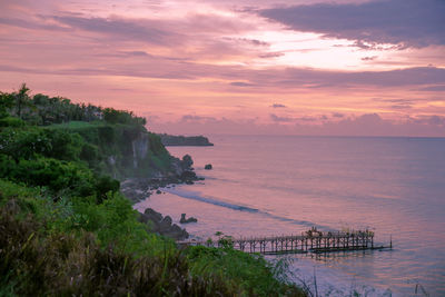 Scenic view of sea against sky at sunset