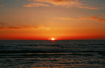 Scenic view of sea against sky during omega sunset