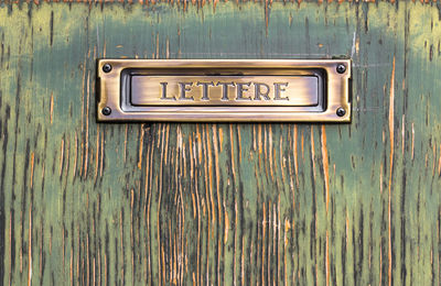 Close-up of mailbox on wall