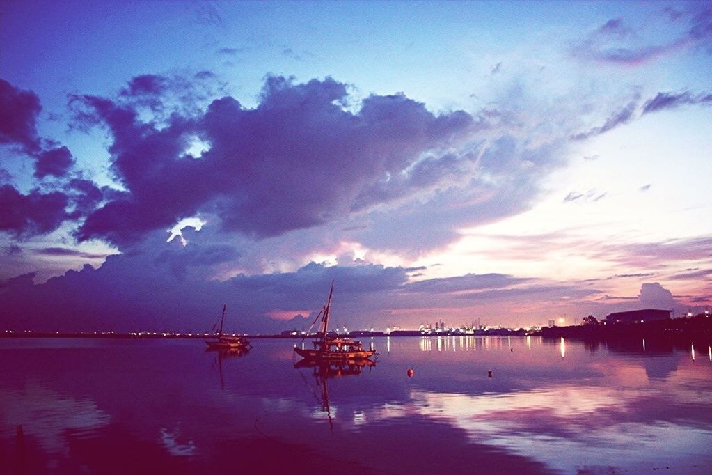 water, sky, sunset, cloud - sky, scenics, waterfront, reflection, nautical vessel, tranquil scene, tranquility, sea, beauty in nature, silhouette, dusk, cloud, nature, lake, illuminated, boat, transportation