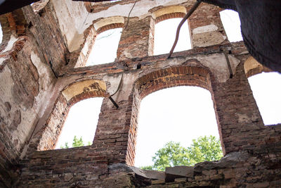 Low angle view of old ruins against clear sky