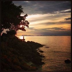 Scenic view of sea at sunset