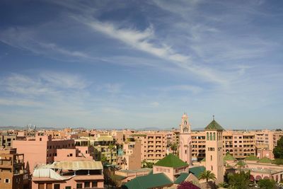 Buildings in city of marrakech against cloudy sky