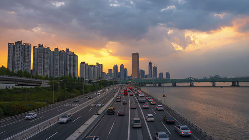 View of buildings in city at sunset