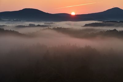 Scenic view of mountains during foggy weather