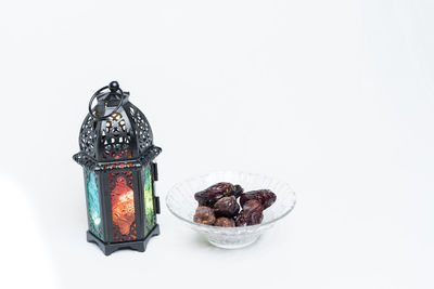 High angle view of fruits in container over white background