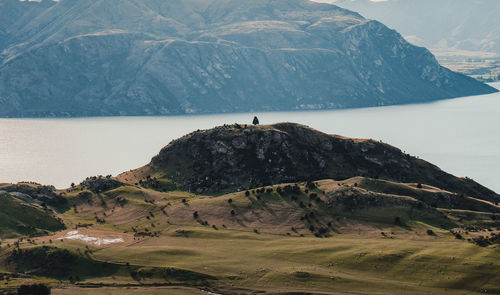 Scenic view of mountain by sea