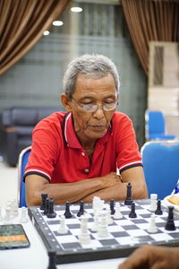 Portrait of man relaxing on table