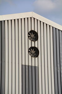 Low angle view of exhaust fan on wall