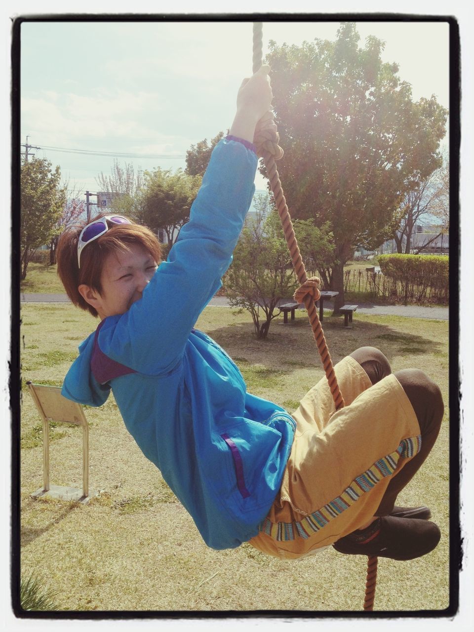 lifestyles, leisure activity, person, transfer print, casual clothing, childhood, tree, auto post production filter, playground, full length, elementary age, boys, sky, sunlight, front view, field, swing, day