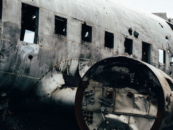 Low angle view of damaged airplane