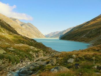 Scenic view of lake and mountains against sky