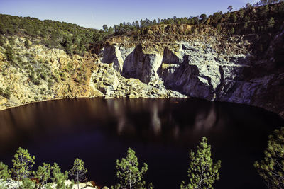 Scenic view of rock formation against sky