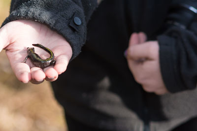 Close-up of man holding hands