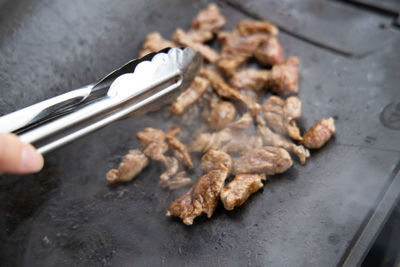 High angle view of meat on barbecue grill