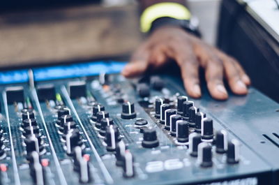 Close-up of man using sound mixer