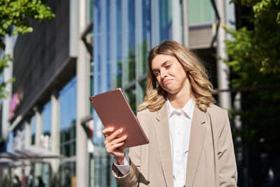 Young woman using digital tablet