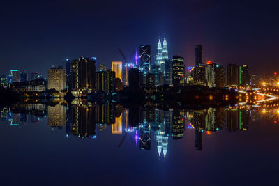 Reflection of illuminated built structures in river