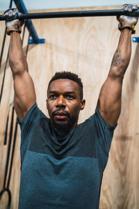 Low angle view of man exercising in gym