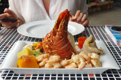 High angle view of person preparing food on table