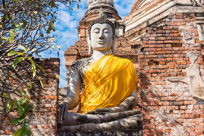 Low angle view of statue against building