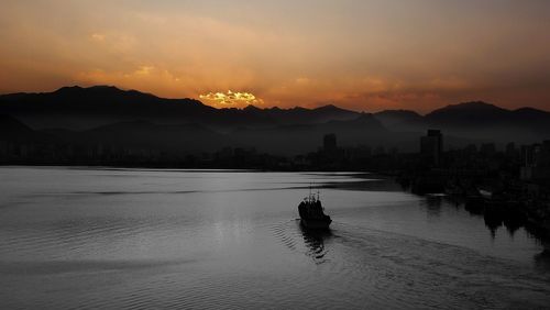 Scenic view of lake against sky during sunset