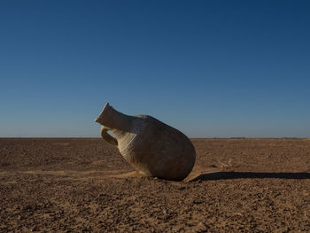 Amphora against clear blue sky