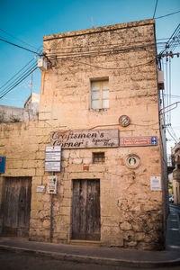 Low angle view of old building against sky