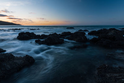 Scenic view of sea against sky during sunset