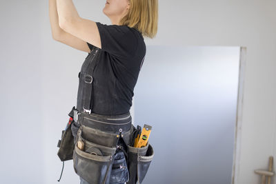 Woman renovating house