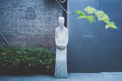 Close-up of statue against building