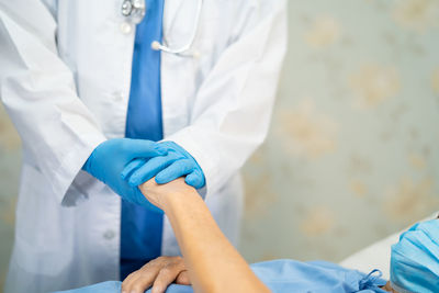 Asian doctor wearing ppe suit new normal to check patient  protect safety infection coronavirus 