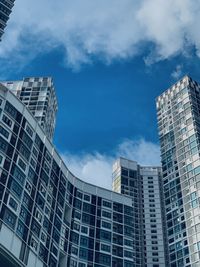 Low angle view of modern buildings against sky