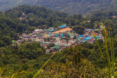 High angle view of townscape by trees and houses