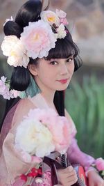 Young woman holding bouquet