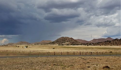 Scenic view of landscape and mountains against sky