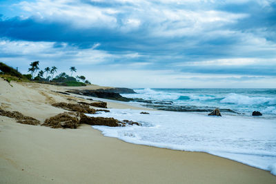 Scenic view of sea against cloudy sky