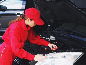 Woman working in car